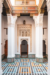 Students study in the historic Madrasa Ben Youssef in Marrakesh, Morocco. The building showcases...