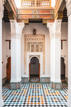 Students study in the historic Madrasa Ben Youssef in Marrakesh, Morocco. The building showcases intricate designs and traditional architecture. It serves as a place of learning and reflection.
