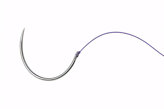 Curved surgical suture needle with purple thread isolated on a white background.