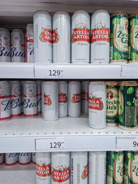 MOSCOW, Russia - March 21, 2026.Rows of Stella Artois beer cans next to Bud and Zatecky Gus on grocery store shelves in Russia
