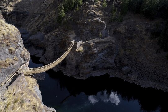 Last useable Inca hanging bridge, rope bridge made of braided Peruvian feather grass (Jarava ichu) over Apurimac, Peru