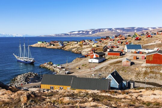 East Greenland town Ittoqqortoormiit with view to the harbour with sailboat, Scoresbysund, East Greenland, Greenland
