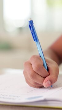 Education, hands and child writing a test for math assessment, equation solution and knowledge. Answer, kid and numeracy assignment in classroom for problem solving, development and exam evaluation