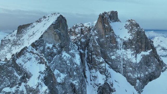 Aerial view of the snow-covered jagged peaks of Parco Naturale Paneveggio Pale di San Martino during winter Primiero San Martino di Castrozza, Trentino-Alto Adige, Italy.