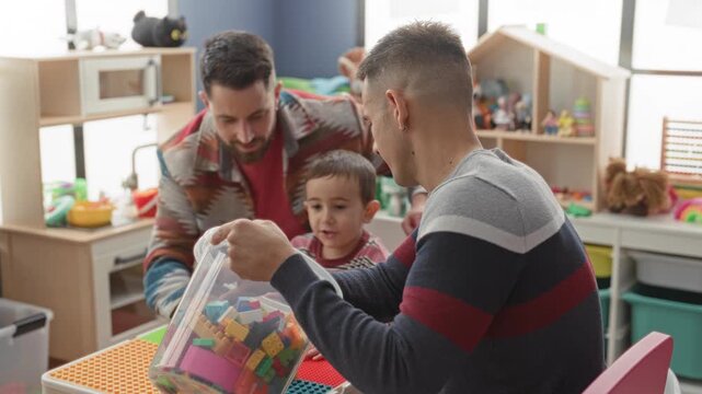 Man helping little boy assemble colorful plastic blocks on table in indoor playroom building, hands placing brick and guiding; play bonding warmth.