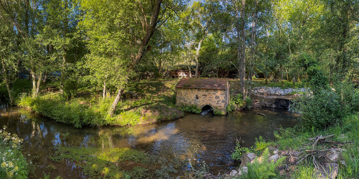 Traditional Stone Watermill by a Creek in Parque de Lazer da V&aacute;rzea Portugal