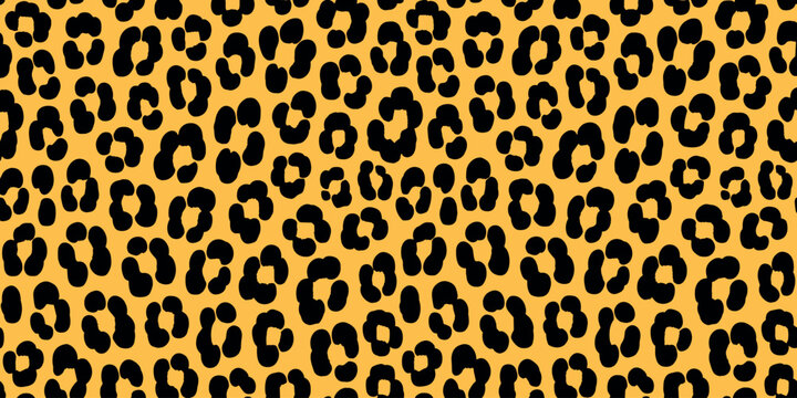 Seamless leopard print pattern with black spots on yellow background