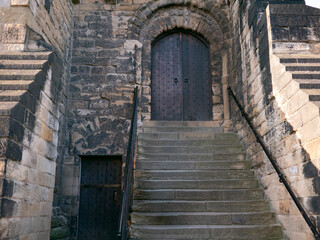 Fototapeta premium Ancient door and staircase, castle in Newcastle upon Tyne, England, built in 12th century.
