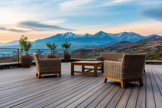 Outdoor patio furniture set overlooking snow capped mountains