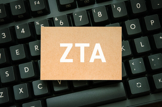 Eye-catching image of ZTA text on card. The word stands for Zero Trust Architecture. Shown with smartphone.