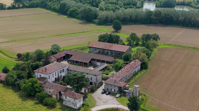 Rural Estate in Italian Countryside: An aerial view showcases a sprawling rustic estate nestled amidst the picturesque Italian countryside.