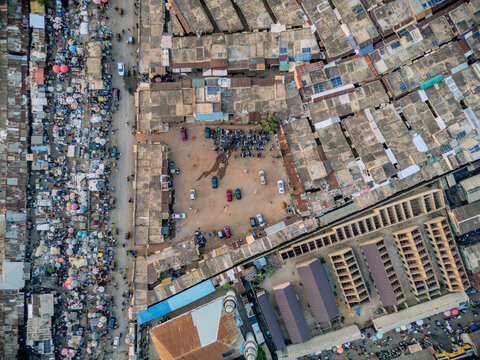 Aerial view of Panteka Market featuring dense rooftops, a central courtyard with vehicles, and crowded market stalls in Kaduna, Kaduna, Nigeria.
