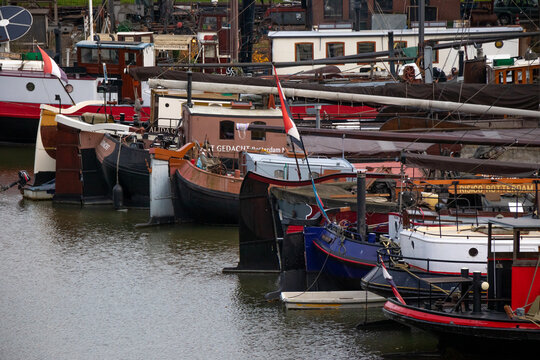 Historic boats docked in Rotterdam harbor, Netherlands