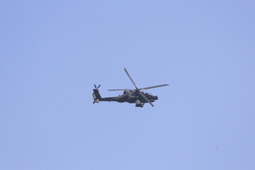 Fototapeta premium Indonesian Army AH-64E Apache Guardian attack helicopter flying in the sky
