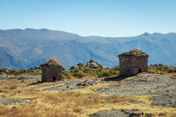 Fototapeta premium Stone huts and mountain landscape in Marcahuasi Peru