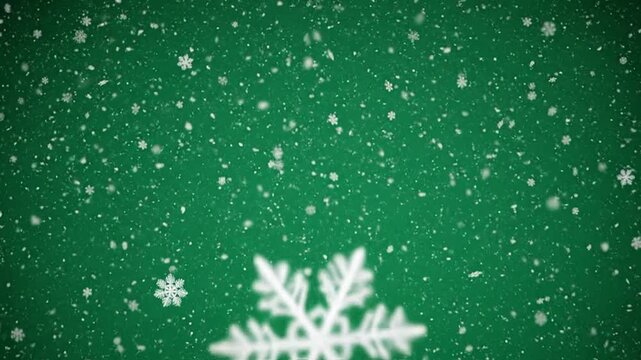 White snowflakes falling gently against a solid dark green background