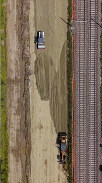 Railroad Construction Site: An aerial view captures the intricate process of railroad construction.