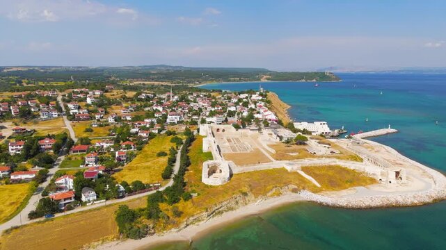 Seddulbahir, Eceabat, Turkey. Restored Ottoman Seddulbahir Fortress, tiered stone bastions and ramparts at Cape Helles, aerial view over the Dardanelles Strait under clear blue sky. Aerial View
