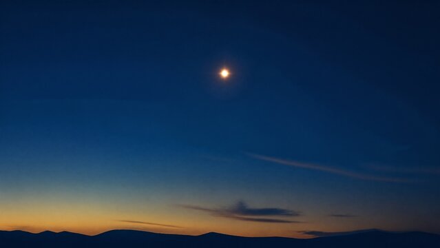 The planet Venus shining in a deep blue twilight sky with a gold palette.