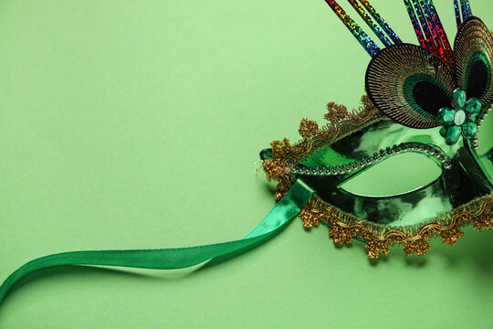 Carnival mask on green background