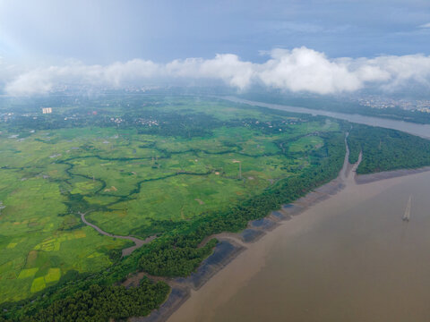 Scenic Monsoon Clouds Over Kalwa, Thane,
drone shot of thane creek with mangroves