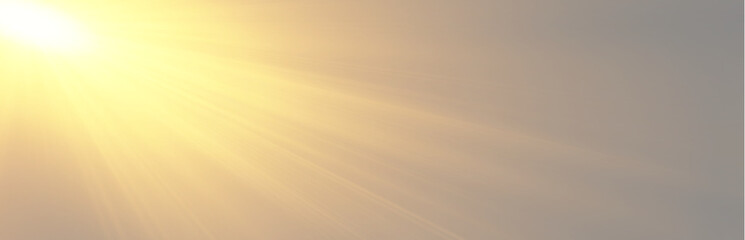 Obraz premium Warm morning sunshine spreading bright diagonal light rays across a hazy sky