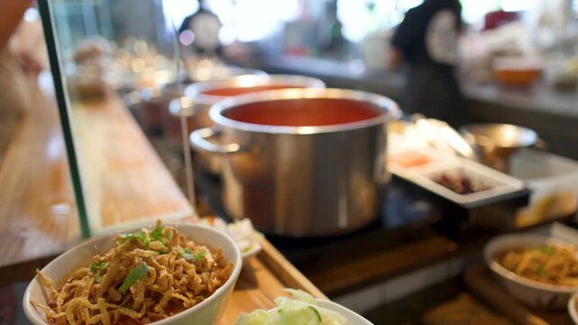 Northern Thai Khao Soi Curry Noodles with Crispy Toppings in Bangkok