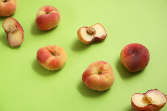 Sweet fig peaches on green background