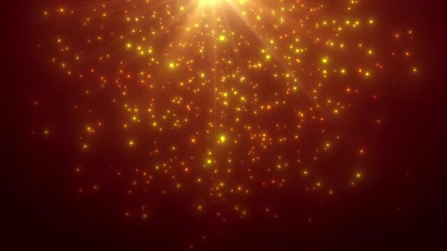 Abstract golden particles falling from a bright light source background loop