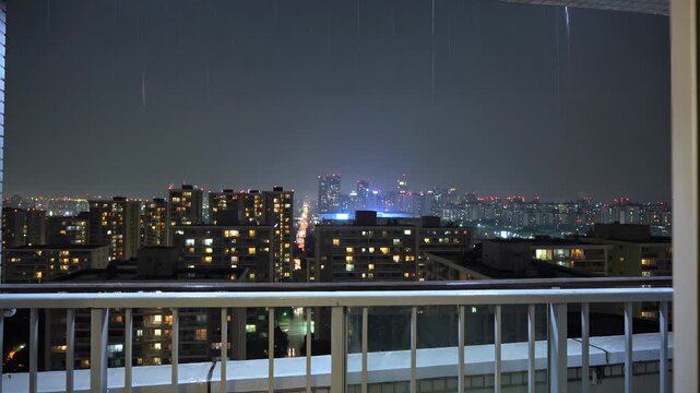 Night View of Apartment Complex Buildings During Rainfall
