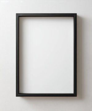 a vertical, blank, black picture frame hanging on a white wall. the frame is empty, with no text or pictures inside. this is a close-up shot of the entire frame, showcasing a simple and minimalistic