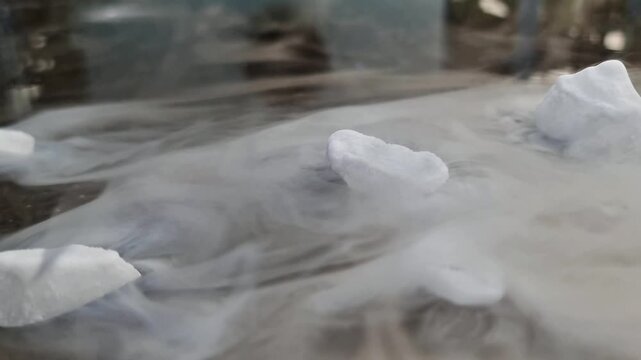 Fluid Dynamics of Dense Smoke from Sublimating Dry Ice on Wet Surface