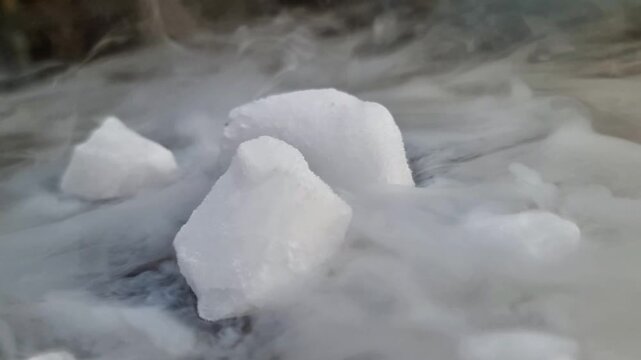 Chemical Experiment Showing Dry Ice Reacting with Water to Form Vapor