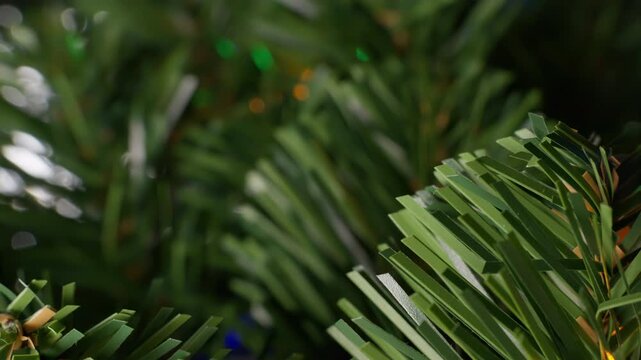 Fake Christmas tree pine leaves close up rotating motion stock footage