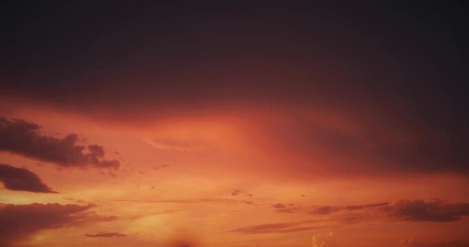 Dramatic Twilight Skies with Fiery Clouds Above Horizon