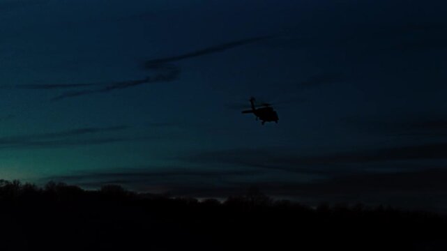 Helicopter flying slowly in the sky