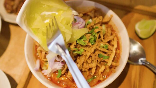 Adding Pickled Mustard Greens to Northern Thai Khao Soi Curry Noodles