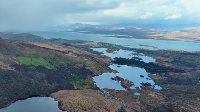 Irish Mountain landscapes Kerry lakes Kenmare Bay and stunning wild scenery Gleninchquin Valley wild Atlantic way on a showery spring day