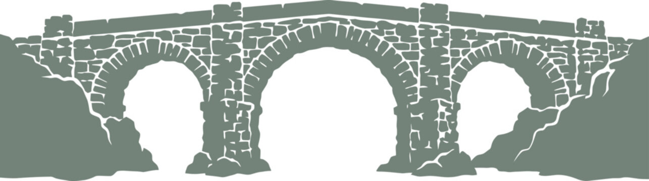 Ancient stone arch bridge spanning across a rocky creek bed