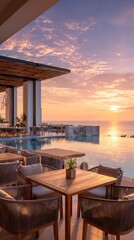 Fototapeta premium Modern outdoor restaurant terrace with wooden tables and chairs overlooking ocean sunset view