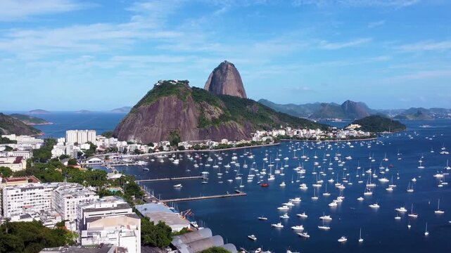 Picturesque footage of Sugar Loaf mountain and Botafogo Bay from a park overlooking Rio de Janeiro, Brazil. International travel destination of coastal city of rio de janeiro brazil , 