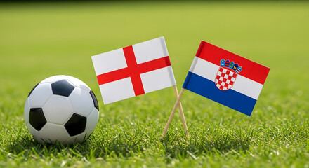 Fototapeta premium Football ball with england and croatia flags on green grass field