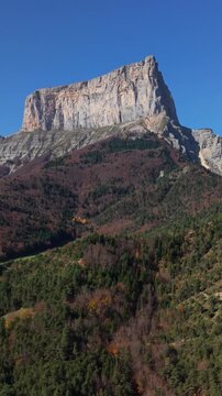 The Vercors Massif range with famous Mont Aiguille mountain peak in autumn (aerial view). Vercors Regional Natural Park, Isere, Rhone-Alpes, Alps, France