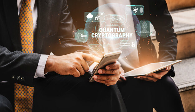 Business Professionals Engaging in Quantum Cryptography Discussion with Smartphone and Tablet in Modern Office Setting Fluxor.