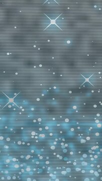 Vertical video: Particles starting with lower bokeh mass, drifting up, twinkling for looping scene