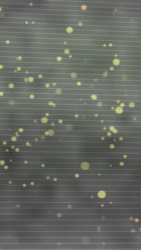 Vertical video: After light pulse lime dots pulsing clustering shifting on ruled pane to show lines
