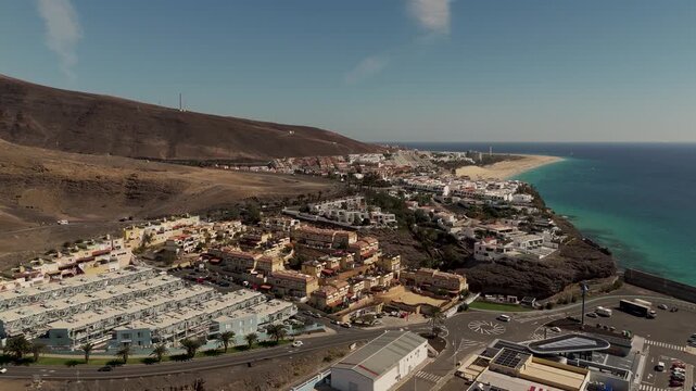 Aerial Orbit of Morro Jable Coastal Town and Atlantic Coastline in Fuerteventura