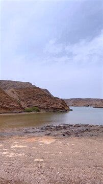 Coastal Drone Survey. Aerial Imagery Of Tranquil Coastal Inlet By Drone. Unmanned Aerial Vehicle Documents Peaceful Inlet Environment With Rocky And Mangrove Features