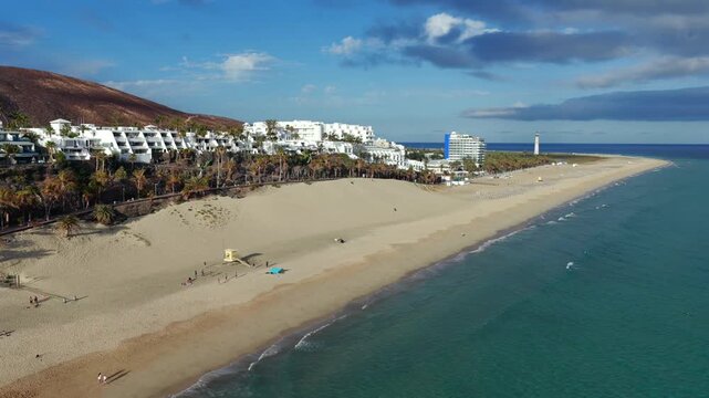 Aerial flyover above Morro Jable Paradise; Turquoise Water, Golden Sand Beaches, and Luxury Resorts in Fuerteventura