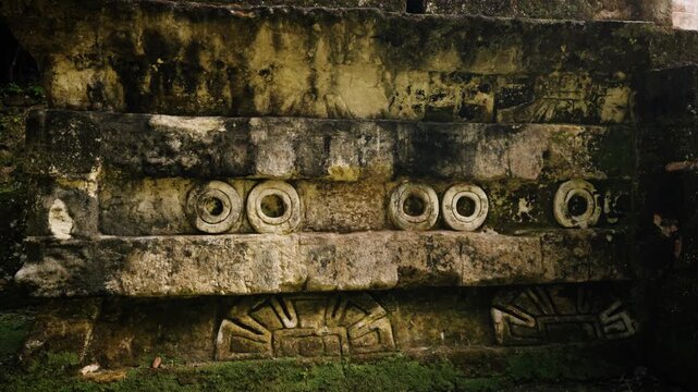 Detailed view of ancient carved stone structure inside Tikal ruins in Guatemala